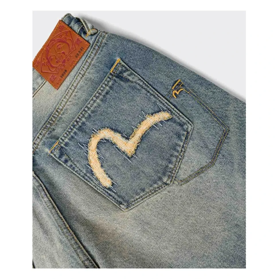 7-lommers jeans med måkebroderi