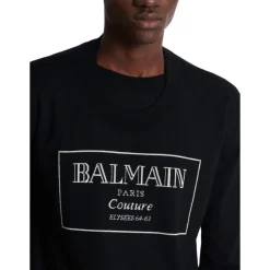 Strikket genser med Couture-etikett